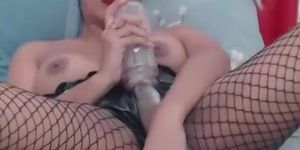 Sexy shemale plays with a suction toy