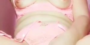 Latina in pink lingerie masturbates on cam