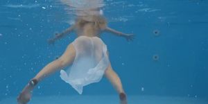 Finnish girl swims nude in the pool