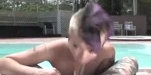 Tattooed punk shaved girl blowing near pool