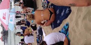 Blonde black thong on beach