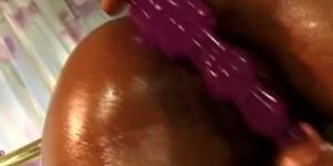 black wife lays down and uses a sex toy to masturbate