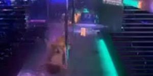 Two strippers having some fun on stage.avi