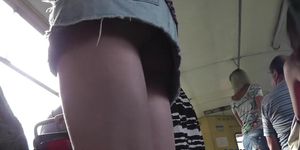 Sexy upskirt view of the chick in short Jeans skirt