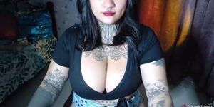 Goth Latina showing her big boobs on cam.