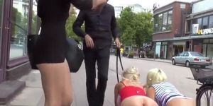 Busty bombshells made to crawl in public
