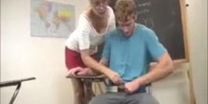 Hot blonde teacher is stroking a big cock