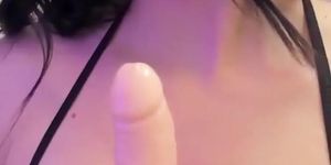 Adorable brunette with braces spits on her tits and on a dildo, she's waiting for your cum