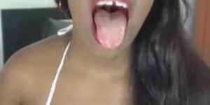 Black chick opens mouth and shows feet for me