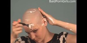 Bald busty girl gives head