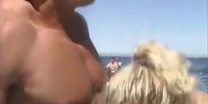 Busty blonde rides on boat