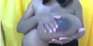 Black babe with mega boobs teasing