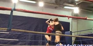 Lesbian babes wrestle in a boxing ring