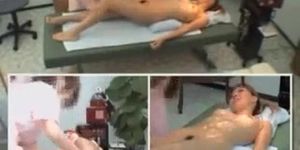 Spy cam shows a naked Japanese girl receiving a massage