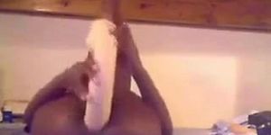 Naughty black girl on webcam fucks herself with huge dildo and teasing