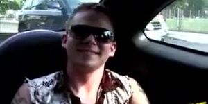 Hot twink with a tattoo jerks in a car while cruising around