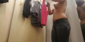 Changing In A Fitting Room Of A Store