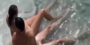 Nudist couple in the water