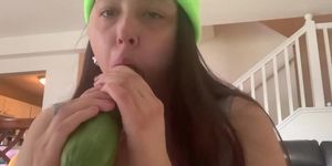 Girl suck a cucumber