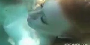 Redhead hottie gives BJ underwater