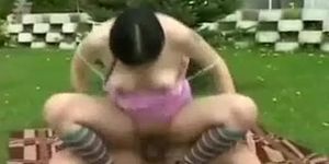 Horny couple take turns riding the strap on dildo outdoor