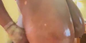 Gam Gam Nessa's oils up her huge titties & Nipples