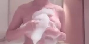 Japanese girl plays with big boobs in the bath