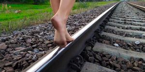 barefeet walking on rails0