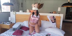 Latina masturbates with a vibrator on a bed
