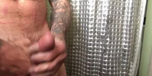 Tattooed Stud strokes his dick for the camera