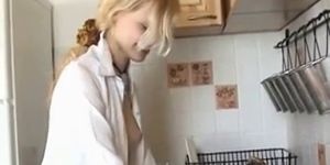 Beautiful girl is masturbing in the kitchen