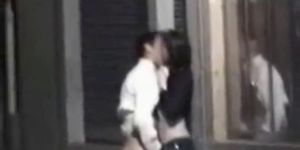 Drunk couple fooling around on the street