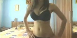 Brunette teen moves her body to the webcam