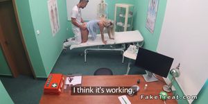 Doctor surprised busty blonde patient