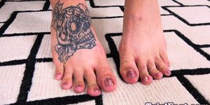 Tattooed TS curling her gorgeous toes - video 1