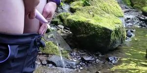 Pissing with my go girl into the river
