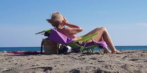 Busty MILF Topless on Beach