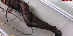 Tattooed redhead takes a shower and masturbates in catsuit (Onix Babe)