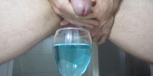 Ejaculating creamy cumshot into a cup of water 2