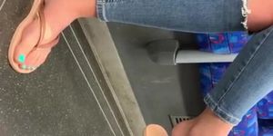 Sexy toes in flip flops on tube