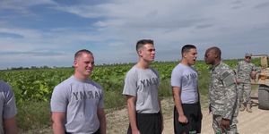 Military hunks stretching asses outdoors