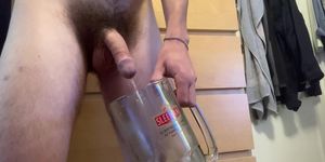 Twink pissing in a glass