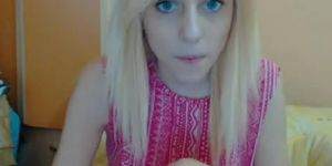 Blue eyed teen shows her pussy