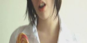 Louisa licks a candy and perform a wild teasing action