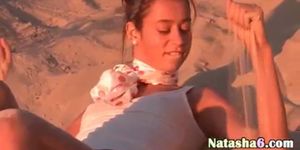 sexy teen undressing on the hot beach