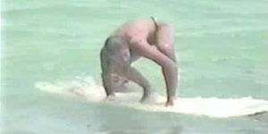 Miami beach - nude girl surfing