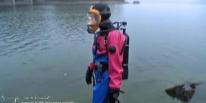 Sexy scuba girl in viking drysuits and mask