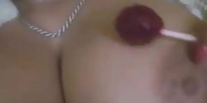 Teen with huge boobs sucking a lolipop and flashing