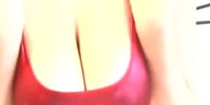 Busty babe in red latex rubbing her boobs - video 1