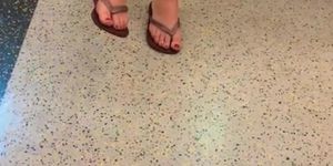 Hot woman sexy legs and red toes on train